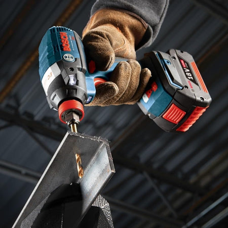 Action shot of a Bosch titanium drill bit boring through heavy-gauge angled structural steel using a cordless impact driver to demonstrate the durability of the titanium nitride coating in high-heat metal applications.