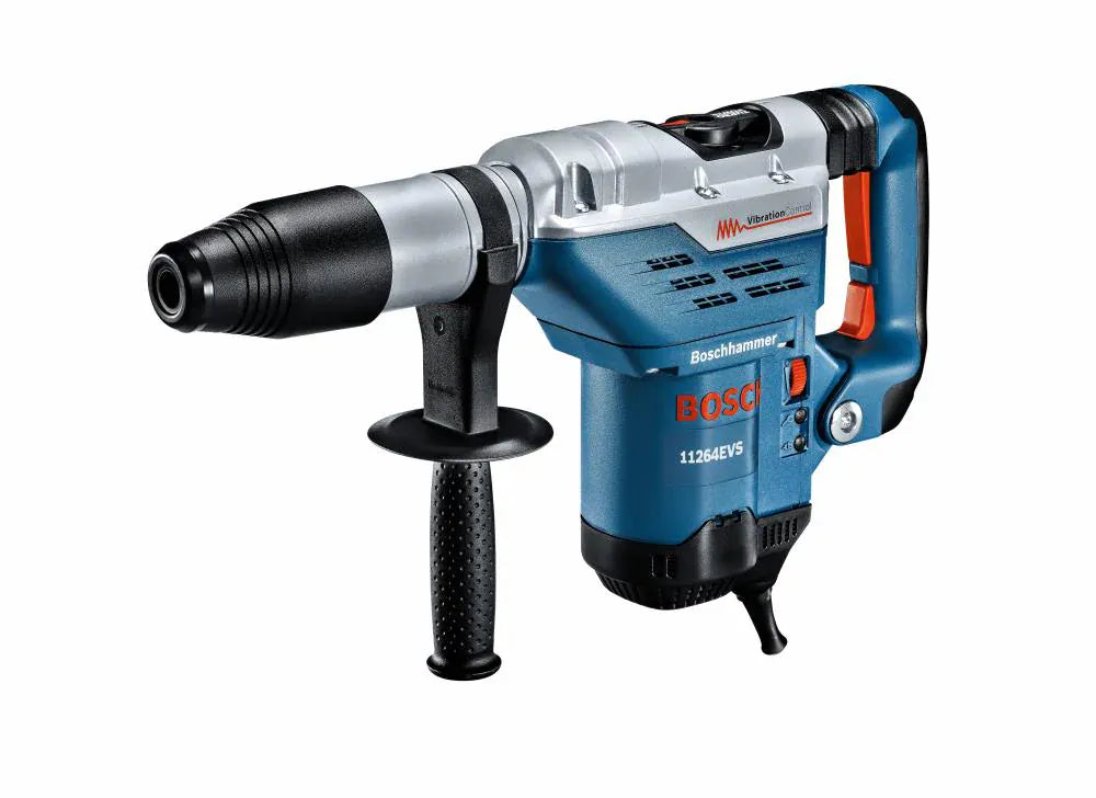 Action shot of a professional contractor using the Bosch 1-5/8 inch SDS-max combination hammer to drill a precision hole into a concrete masonry unit wall at a construction site.