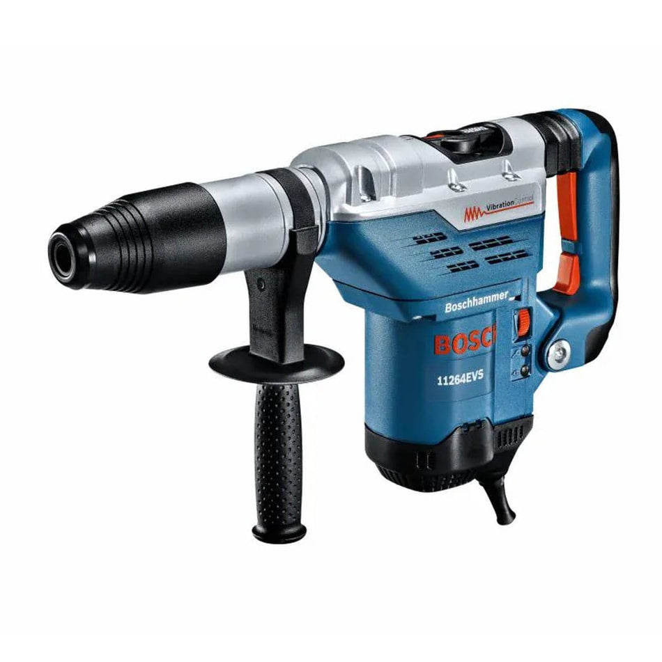 Action shot of a professional contractor using the Bosch 1-5/8 inch SDS-max combination hammer to drill a precision hole into a concrete masonry unit wall at a construction site.