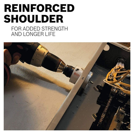 Close-up action shot of the hole saw cutting into a grey metal electrical box, with text pointing out the reinforced shoulder for added strength.
