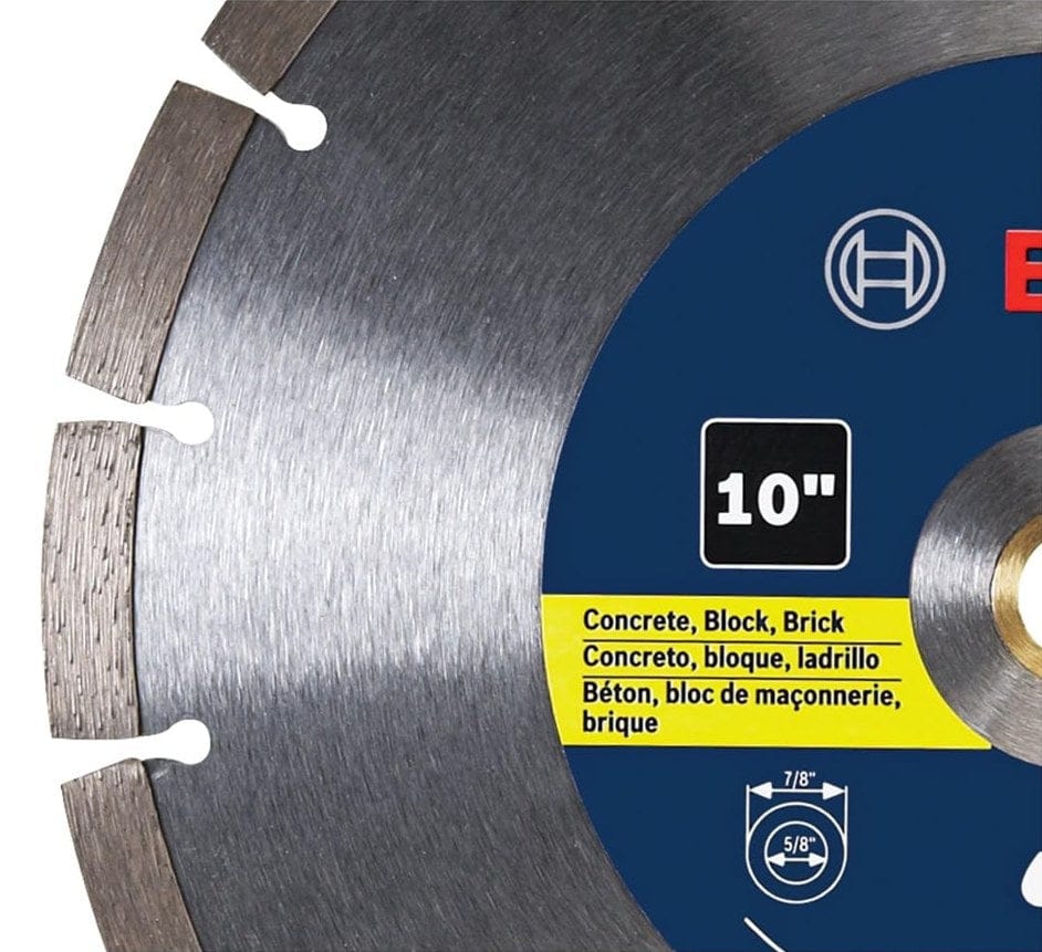 Close-up of a Bosch 10-inch segmented diamond blade showing labeled specifications for cutting concrete, block, and brick; includes multilingual text and visible arbor sizes of 7/8 inch and 5/8 inch.