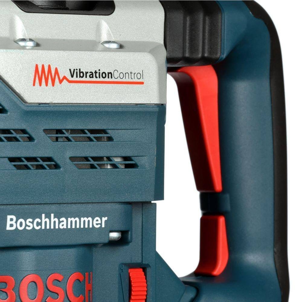 A close-up view of the rear handle highlighting the vibration control dampening zone and the large trigger switch.