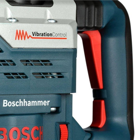 A close-up view of the rear handle highlighting the vibration control dampening zone and the large trigger switch.