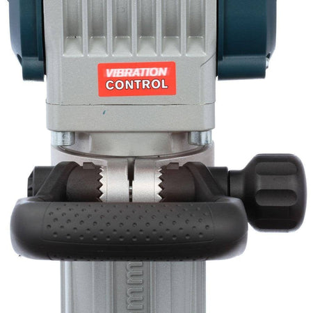 A close-up view of the auxiliary handle mounting area on the breaker hammer, featuring the red Vibration Control label.