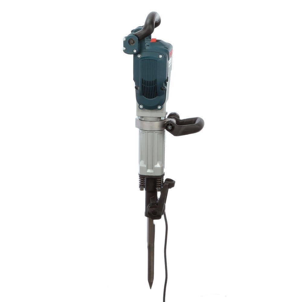 Side profile view of the demolition hammer highlighting the 360-degree articulating auxiliary handle and the tool retainer mechanism.