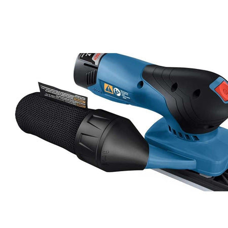 Close-up of Bosch electric sander with dust collection canister and red power button; ergonomic contours for grip.