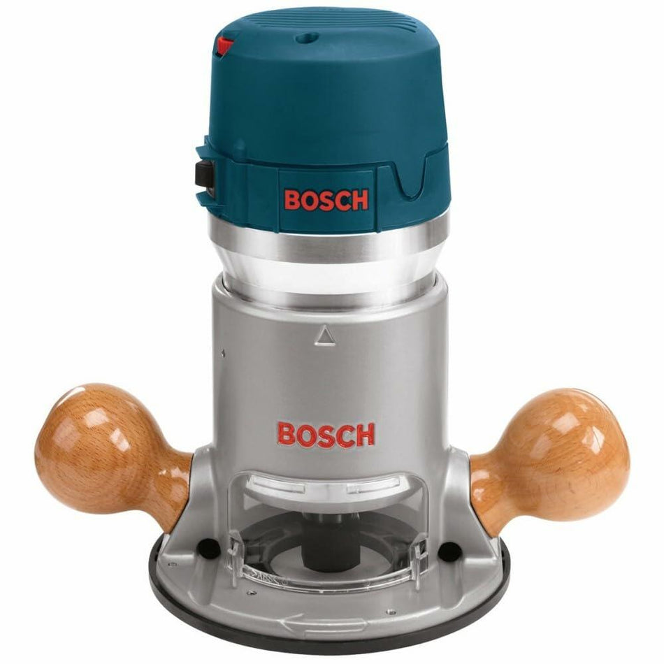 Bosch plunge router with teal motor housing, metallic body, and transparent base. Wooden handles on both sides for manual control. Designed for precision woodworking and cabinetry.
