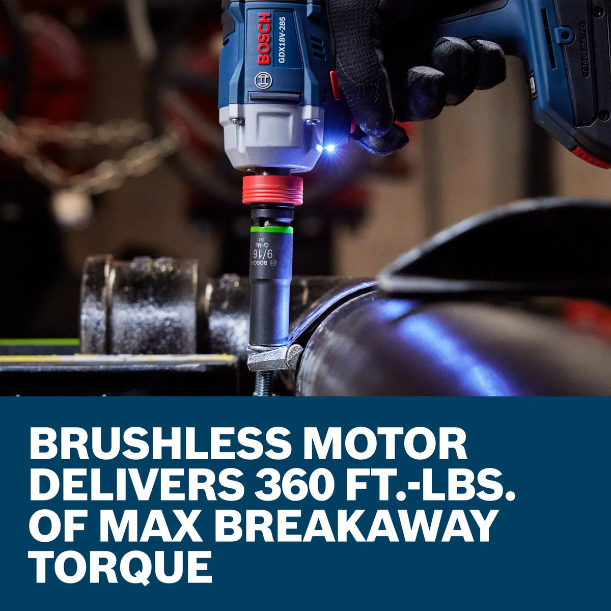 A technician uses the Bosch combination socket screwdriver tool to drive a vertical fastener on a large industrial pipe coupling assembly. The camera focuses closely on a 9/16-inch impact socket spinning onto a bolt head, accompanied by graphic overlay text stating that the brushless motor delivers 360 foot-pounds of maximum breakaway torque.