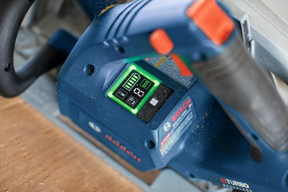 Close-up of Bosch BITURBO Brushless cordless planer digital display showing battery level, speed setting, and mode icons.