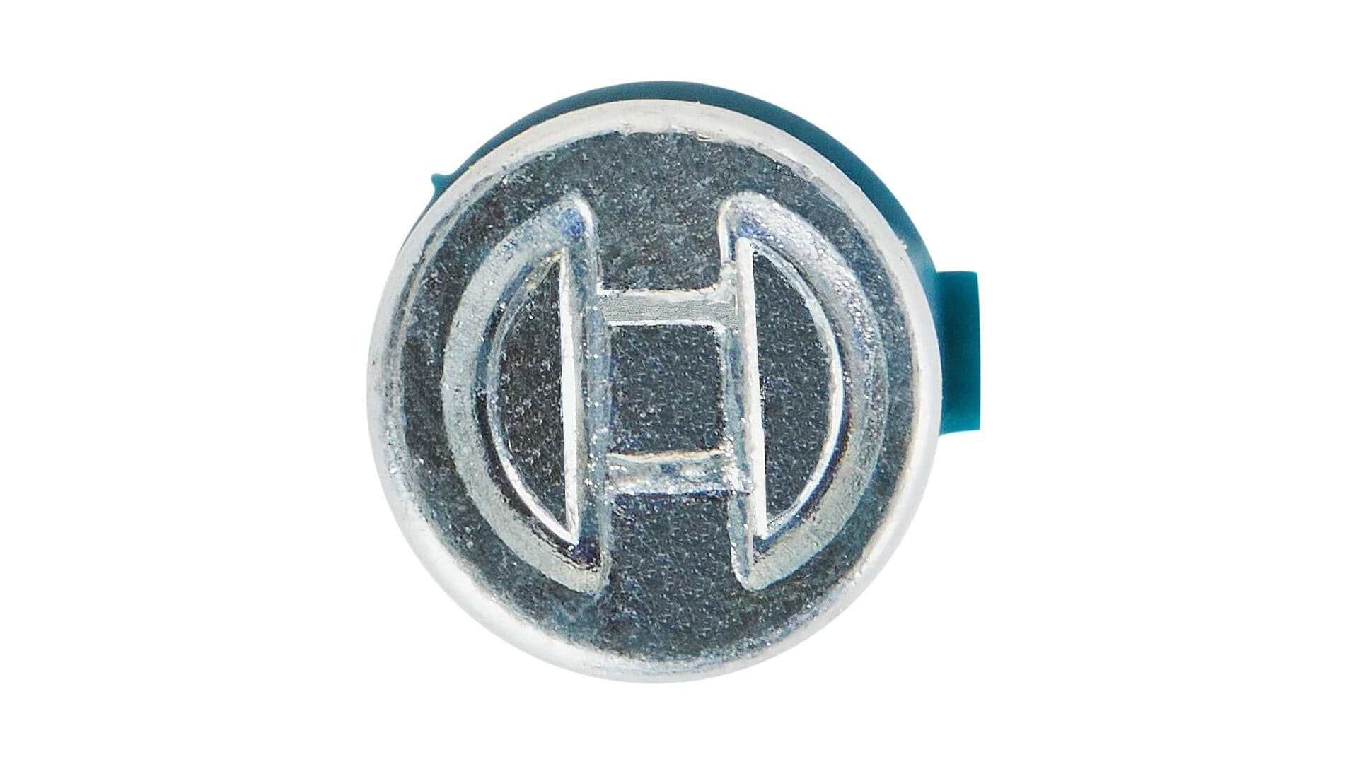 Close-up of a circular metallic emblem with a raised Bosch-style logo featuring a stylized “H” and curved lines. Textured background and blue tab suggest it is part of a branded mechanical or electronic component.