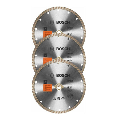 BOSCH DB742SB3 3 pc. 7" Standard Turbo Rim Diamond Blades for Smooth Cuts. 
The image shows a stack of three identical circular diamond blades, each with a silver-gray center and a light brown, ridged outer rim. The "BOSCH" logo is prominently featured in black text near the top of each blade, along with various technical specifications and safety icons.