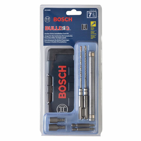 The complete Bosch HC2309 7-piece anchor drive installation tool kit displayed inside its original clear retail clamshell blister packaging, showing the blue paper card labeling with product model details and international translation texts.