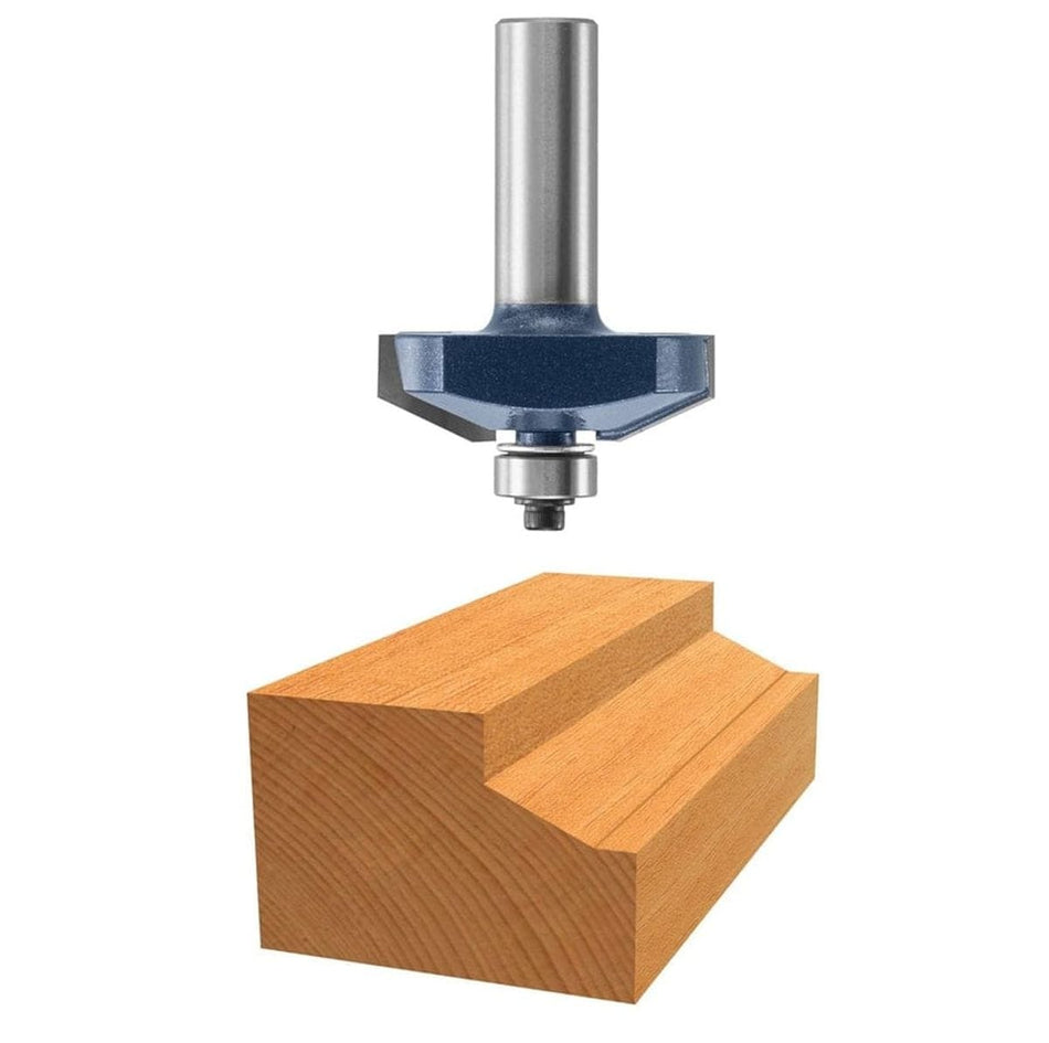 A professional product photo of the Bosch 85583M carbide-tipped raised panel router bit positioned above a sample wood block that displays the precise cove-style profile cut by the bit.