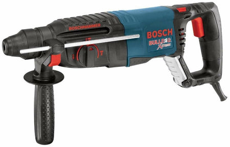 A left-side profile view of the Bosch Bulldog Xtreme rotary hammer with the auxiliary handle and metal depth gauge attached.