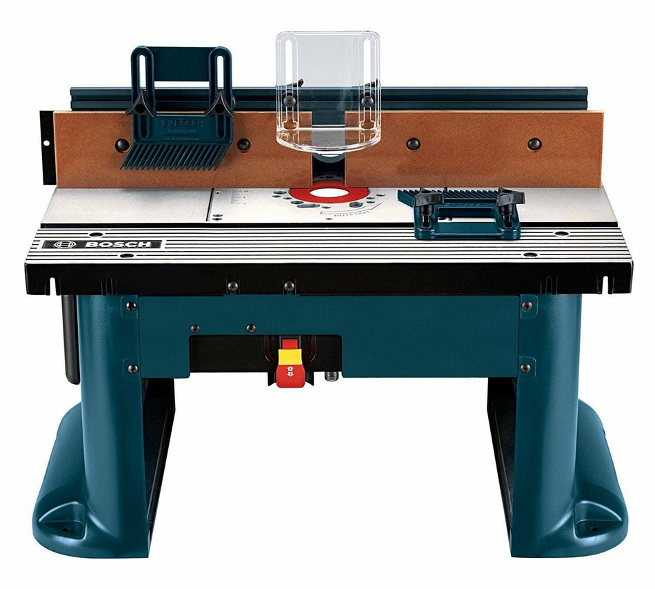 Front straight-on studio view of the Bosch RA1181 benchtop router table highlighting the tall fence assembly, integrated featherboards, and the front-mounted power switch with safety lock
