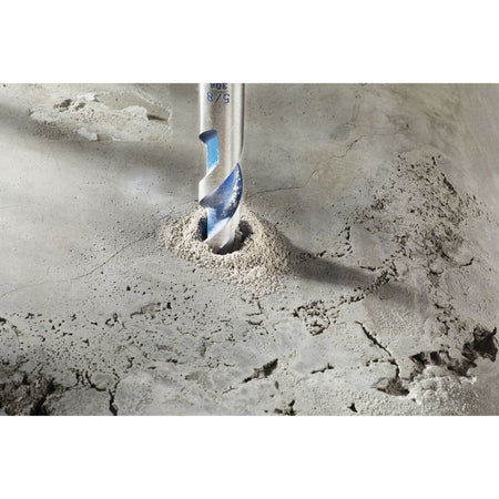 A high-resolution product close-up of the multi-grind carbide tip on the Bosch BlueGranite Turbo masonry drill bit, showcasing the specialized sharp cutting edges, the integrated blue spiral U-flute for efficient dust removal, and the tungsten carbide insert built for impact durability in aggregate materials.