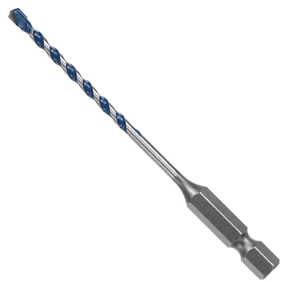 An isolated product studio shot of a single Bosch Blue Xtreme masonry drill bit positioned diagonally against a crisp white background, showcasing its solid 1/4-inch hex shank base, a long slim metal body shaft, deep spiral U-flutes finished with a blue coating, and an aggressive carbide cutting point.