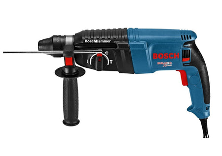 Side profile view of the Bosch Bulldog Xtreme rotary hammer highlighting the red mode selector switch and heavy-duty cord turret.
