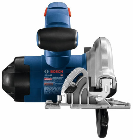 Front view of Bosch CCS180 circular saw showing blade guard, adjustment gauge, and safety label with usage warnings.