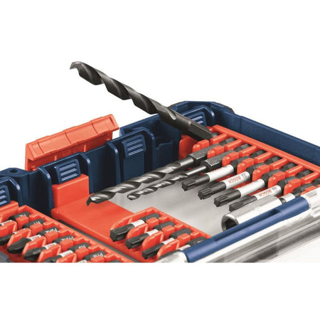 A close-up product studio shot showing a single black oxide twist drill bit being tilted upward out of its slot inside an opened blue Bosch custom case organizer storage unit, demonstrating the single-handed mechanical tilt-in tilt-out convenience of the orange bit clips.