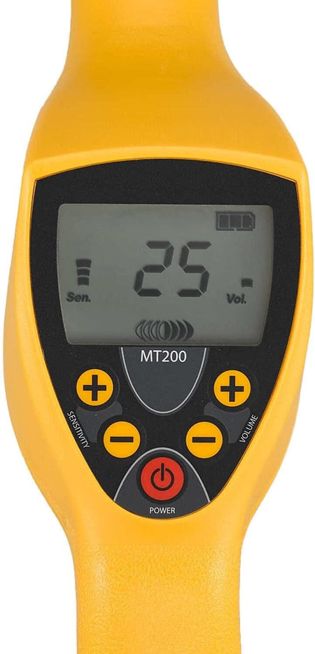 A close-up of the Magna-Trak MT200 interface, featuring a digital LCD screen showing numeric and bar graph readouts, plus tactile buttons for power, volume, and sensitivity adjustments.