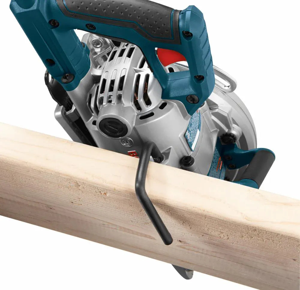 A close-up action view of the backend of the Bosch CSW41 circular saw body, demonstrating the functional deployment of the thick black metal rafter saw hook as it slots down securely over a piece of dimensional structural timber.