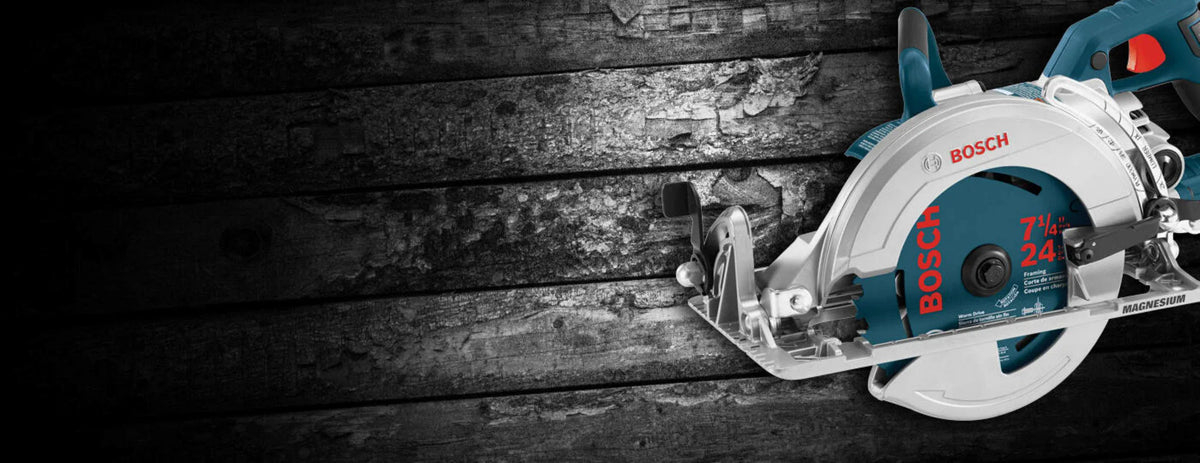 A widescreen digital marketing header image displaying a high-resolution side view of the silver and blue Bosch CSW41 magnesium worm-drive saw positioned over a dark, rustic textured horizontal wood plank background.