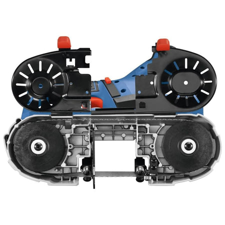 Product view showing the underside of the Bosch compact band saw with the tool-free tracking cover guard swung open, revealing the two internal rubber-tired drive wheels and blade tracking mechanism.