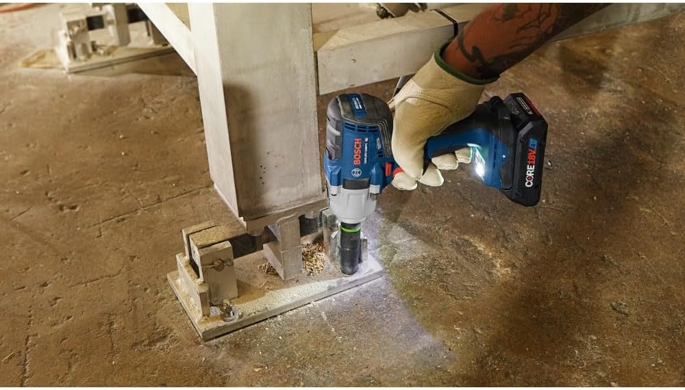 Setting concrete screw anchors into an industrial foundation plate using the Bosch GDS18V-330PC impact wrench.