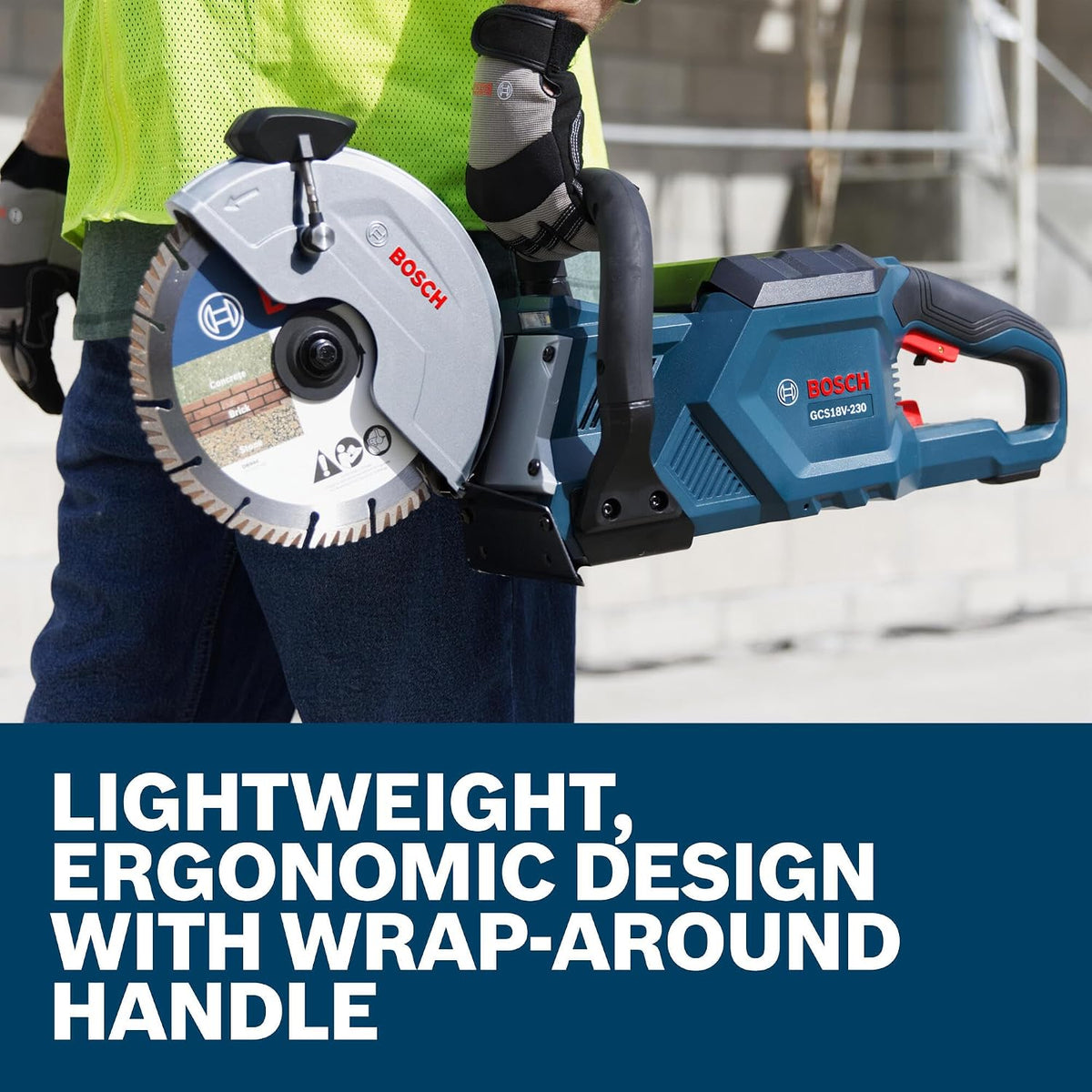 Worker holding the Bosch GCS18V-230N cutoff saw showing the lightweight ergonomic wrap-around handle design.