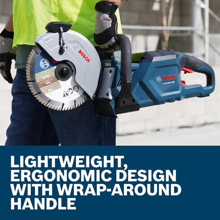Worker holding the Bosch GCS18V-230N cutoff saw showing the lightweight ergonomic wrap-around handle design.