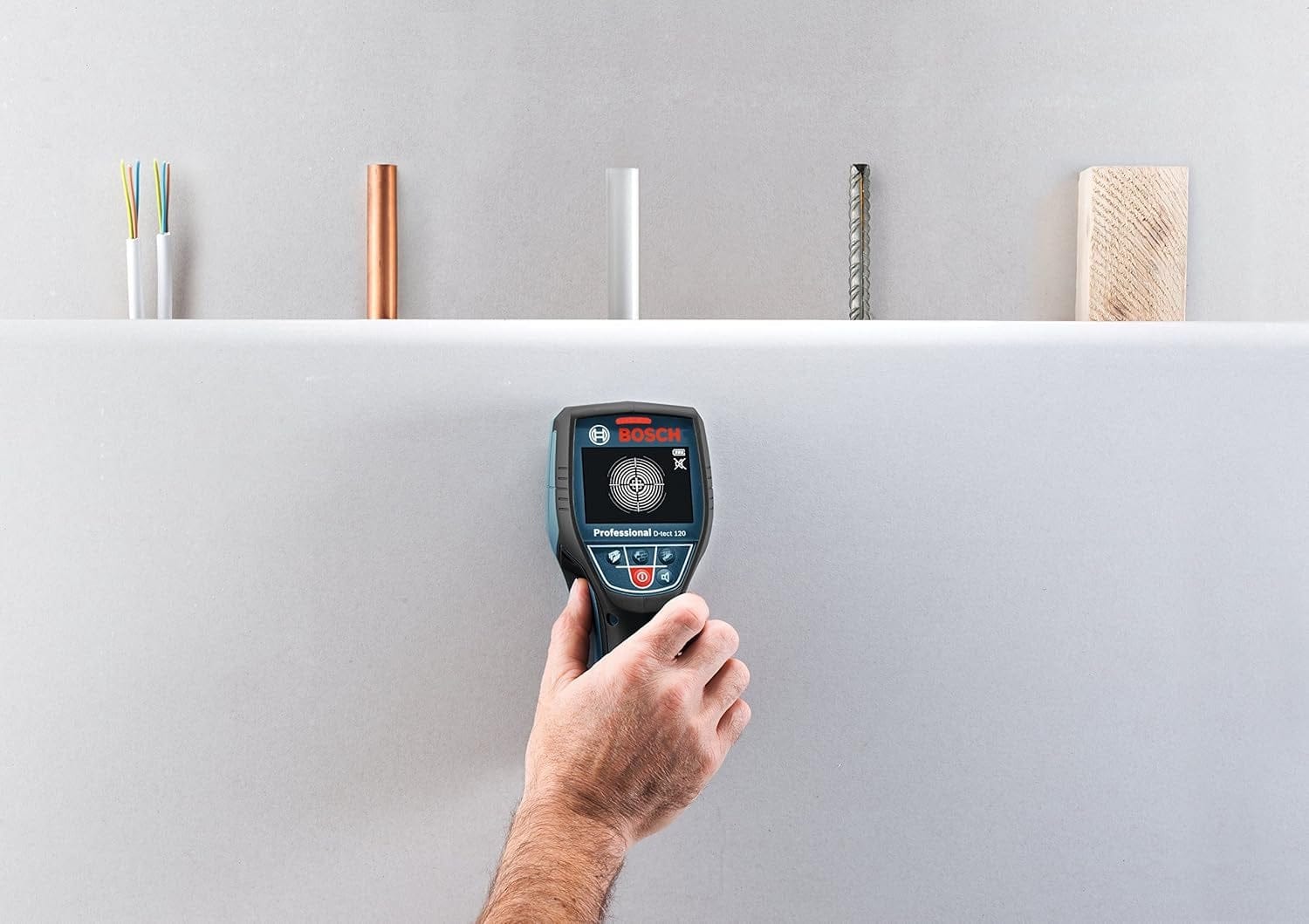 Bosch GMS 120 detector scanning wall; five material types shown above including wire, copper, plastic, steel, and wood.