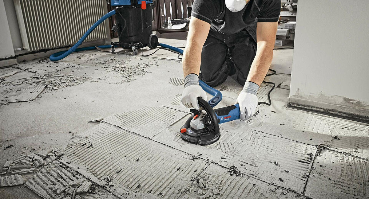 BOSCH DC510HD 5 In. Double Row Segmented Diamond Cup Wheel used for floor removal and grinding tasks.