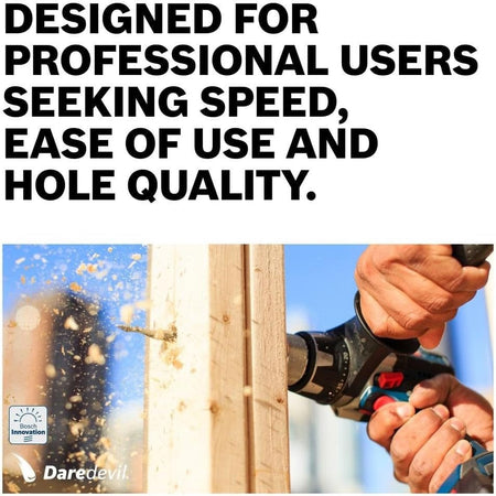Action shot of a person using a drill with a Daredevil spade bit to bore a hole through a wooden stud.