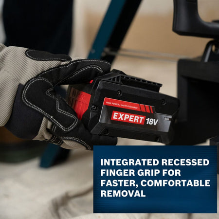 A macro action shot focusing on a worker's gloved hand engaging the integrated recessed finger grip slot along the side base of a Bosch EXPERT 18V battery pack to demonstrate fast tool extraction, sitting above a blue banner text panel.