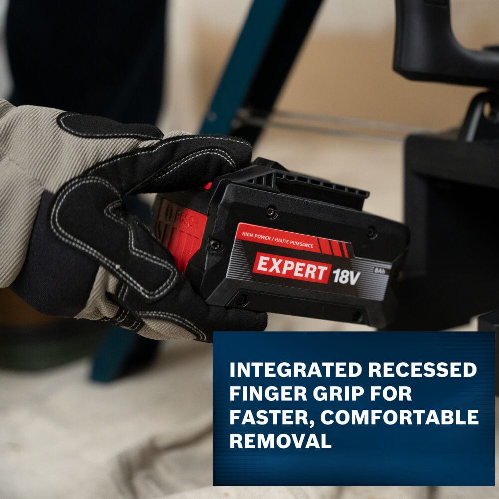 A macro action shot focusing on a worker's gloved hand engaging the integrated recessed finger grip slot along the side base of a Bosch EXPERT 18V battery pack to demonstrate fast tool extraction, sitting above a blue banner text panel.