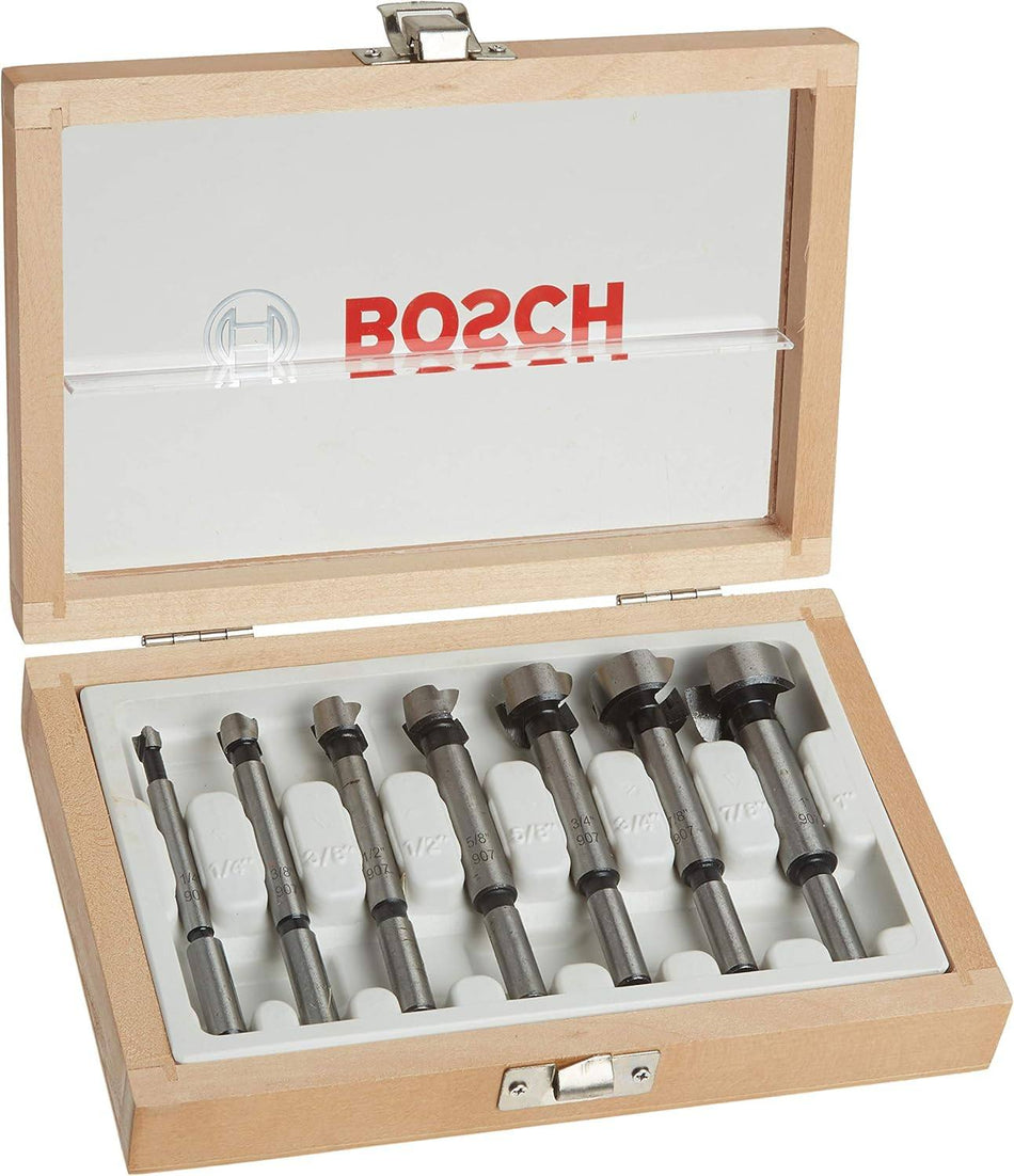 Studio view of the open wooden storage case displaying seven Bosch Forstner bits organized by size in a white tray.