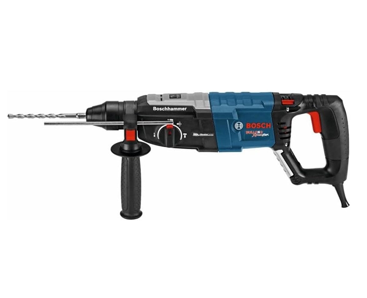 Side profile view of the Bosch GBH2-28L-RT SDS-plus rotary hammer with a masonry drill bit and depth gauge installed for precise heavy-duty masonry drilling applications.