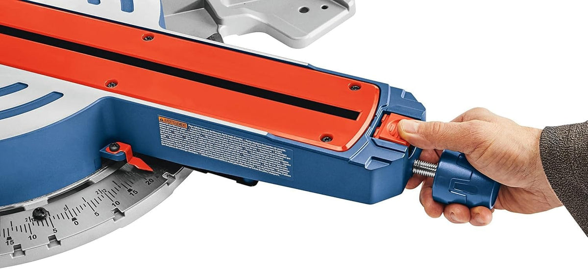 Detailed view of a user's hand operating the miter lock handle and detent override on the Bosch 12 inch saw, demonstrating ergonomic control for fast and accurate angle adjustments.