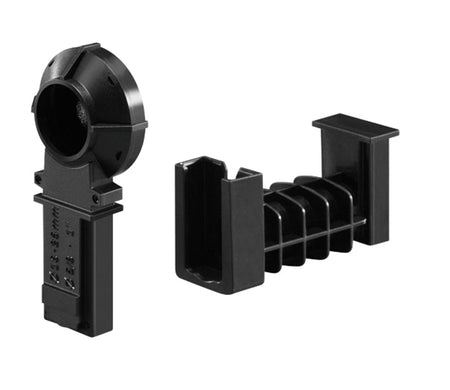 Two black plastic components used for cable management or mounting, one with a circular guide and one with parallel fins.


