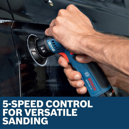 A close-up action view of a detailing professional's hand guiding the Bosch GEX12V-77N cordless handheld sander across the black paint surface of a vehicle panel. The tool is equipped with a black hook and loop backing pad interface, set above a bold blue graphic text banner reading 5-speed control for versatile sanding.