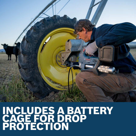 A lifestyle shot of a worker using the Bosch cordless grease gun to maintain a large agricultural pivot irrigation tire, showcasing the rugged battery cage designed for protection in harsh outdoor environments.