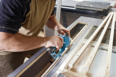 Bosch GHO12V-08N 12V Max Cordless Brushless Hand Planer trimming wood with compact design for precision finishing
