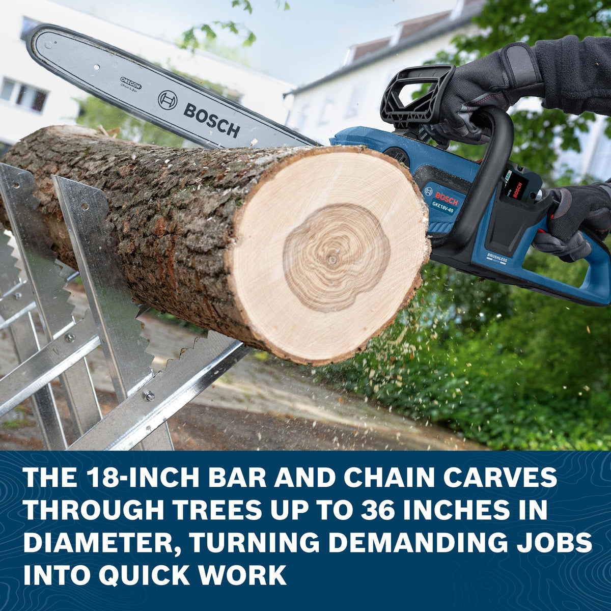 An action application view of a worker using the Bosch cordless chainsaw to slice through a large timber log resting on a heavy-duty metal sawbuck, wood dust spraying out below a dark blue descriptive banner reading THE 18-INCH BAR AND CHAIN CARVES THROUGH TREES UP TO 36 INCHES IN DIAMETER, TURNING DEMANDING JOBS INTO QUICK WORK.