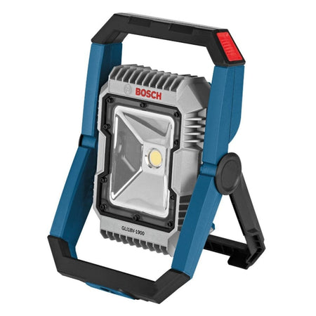 Professional studio shot of the Bosch GLI18V-1900 18V LED floodlight. The light features a blue and black frame with a swiveling stand and a silver heat sink around the central LED.