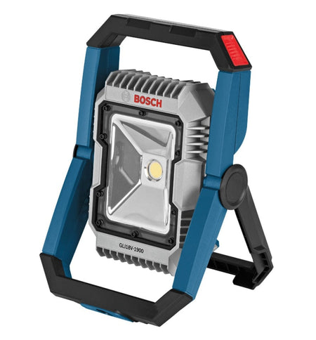 Professional studio shot of the Bosch GLI18V-1900 18V LED floodlight. The light features a blue and black frame with a swiveling stand and a silver heat sink around the central LED.