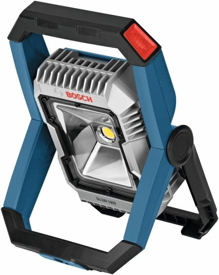 Three-quarter view of the Bosch GLI18V-1900 floodlight adjusted to a forward-facing angle on its black swiveling stand.