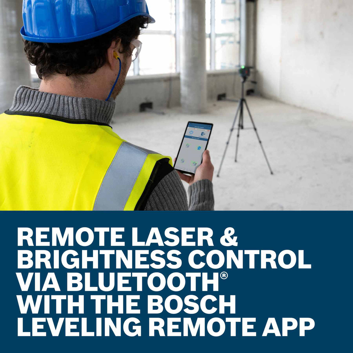 A worker standing in a large commercial space viewing a smartphone screen to control a tripod-mounted laser level in the distance, illustrating the text Remote Laser and Brightness Control via Bluetooth with the Bosch Leveling Remote App.