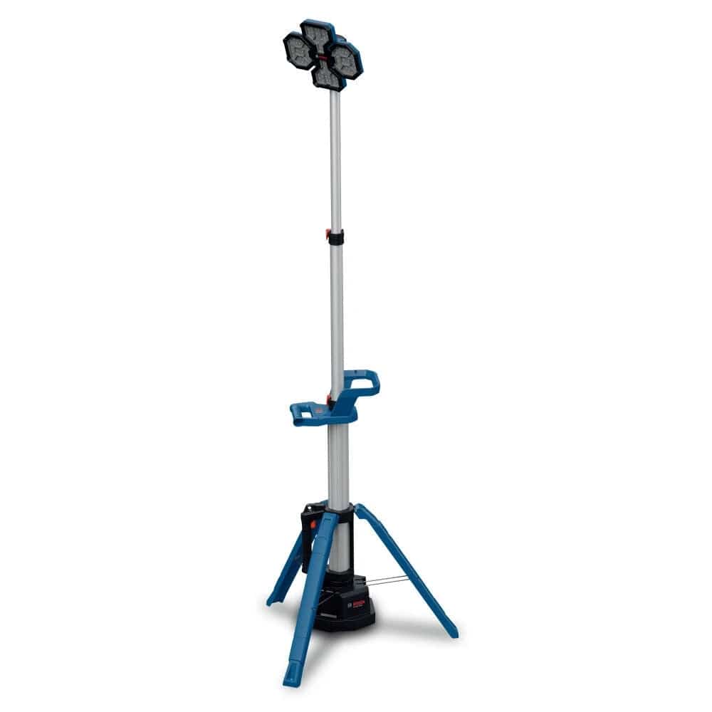 A studio product shot of the Bosch GLT18V-5000 18V tower light fully extended on its integrated tripod stand, showing the silver telescopic pole and the multi-directional three-panel LED light head.