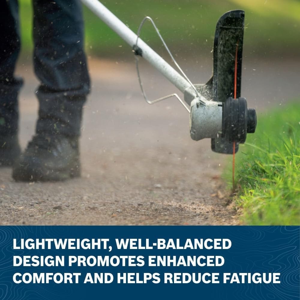 A close-up action shot of the Bosch 16 inch string trimmer head edging along a concrete walkway, showcasing the well-balanced design and specialized debris guard that promotes operator comfort and precision.